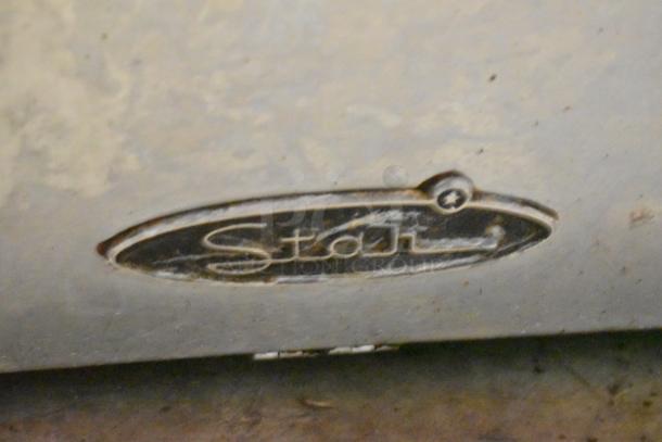 Star Stainless Steel Commercial Countertop Flat Top Griddle, featuring worn finish and brand logo visible on surface.