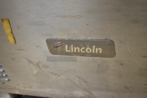 Lincoln Impinger 1961-Q stainless steel pizza oven, electric, 208 volts, 3 phase, Lincoln logo visible, commercial use.