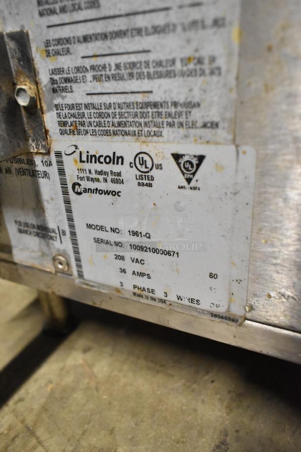 Lincoln Impinger 1961-Q pizza oven label showing model, voltage 208V, phase 3, 36 amps, and UL certification.
