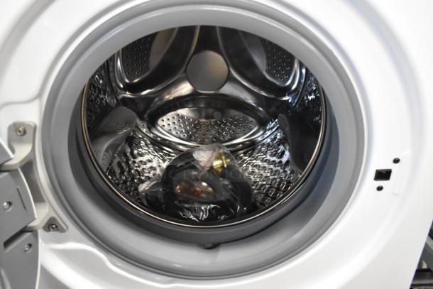 Brand new KoolMore front load washer, scratch and dent condition, stainless steel drum, includes accessories in packaging.