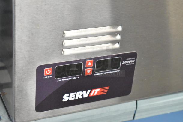 Brand new ServIt 423FW200D stainless steel 12" x 20" dual well electric food warmer. Digital controls visible. 120V, 1 phase.