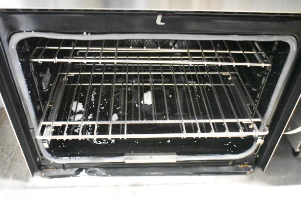 Viking VDOE530SS01 stainless steel double convection oven, missing door, 208/240 volts, interior view showing racks.