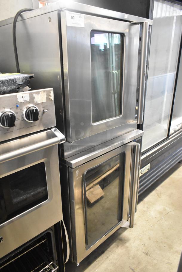 Moffat E89AMS Turbofan stainless steel proofer cabinet and E32MS convection oven with view doors, on commercial casters.