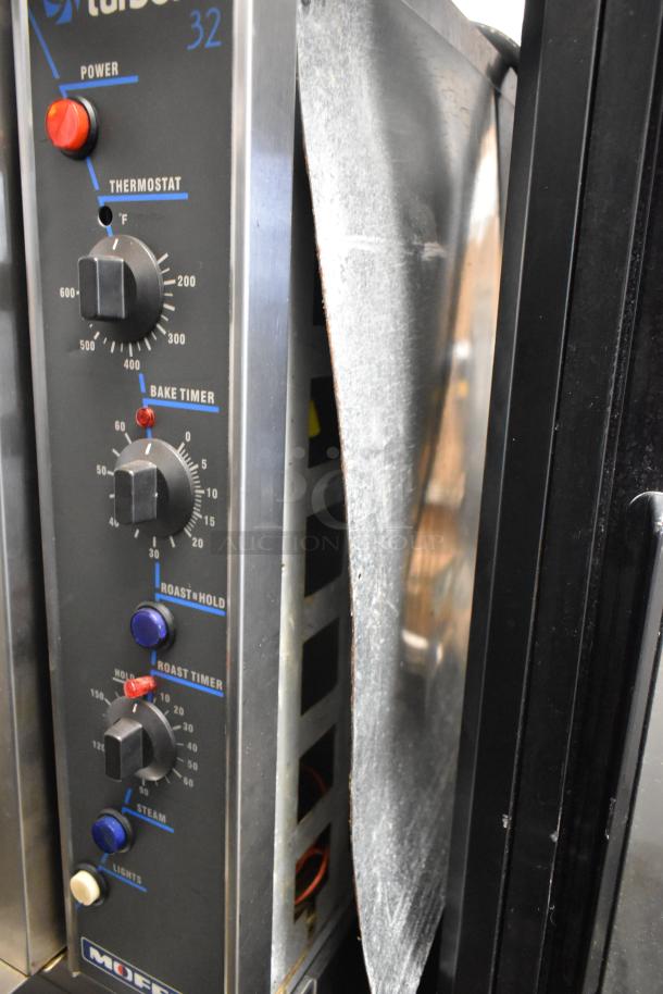 Moffat E32MS Turbofan 32 convection oven controls with thermostatic dials, bake timer, and stainless steel finish.