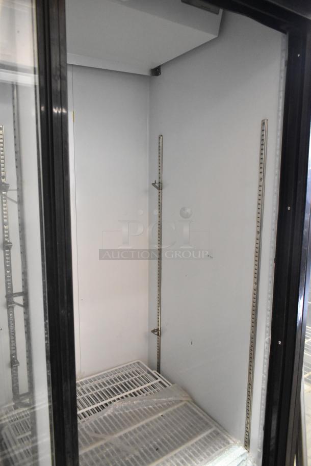 Avantco 178GDS47 commercial 2-door reach-in cooler, poly-coated racks, metal frame, 115V, 1 phase, clean interior.