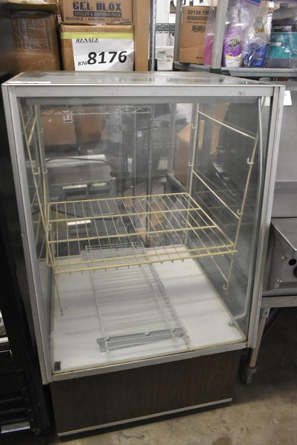 Metal floor-style dry display case with clear glass panels and wire shelves. Visible signs of wear. Auction lot number 8176.