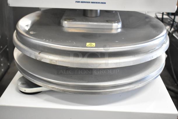 Dough Xpress DXE-W commercial dough press, metal, 120V, 1 phase, countertop model, minor use wear, visible caution label.