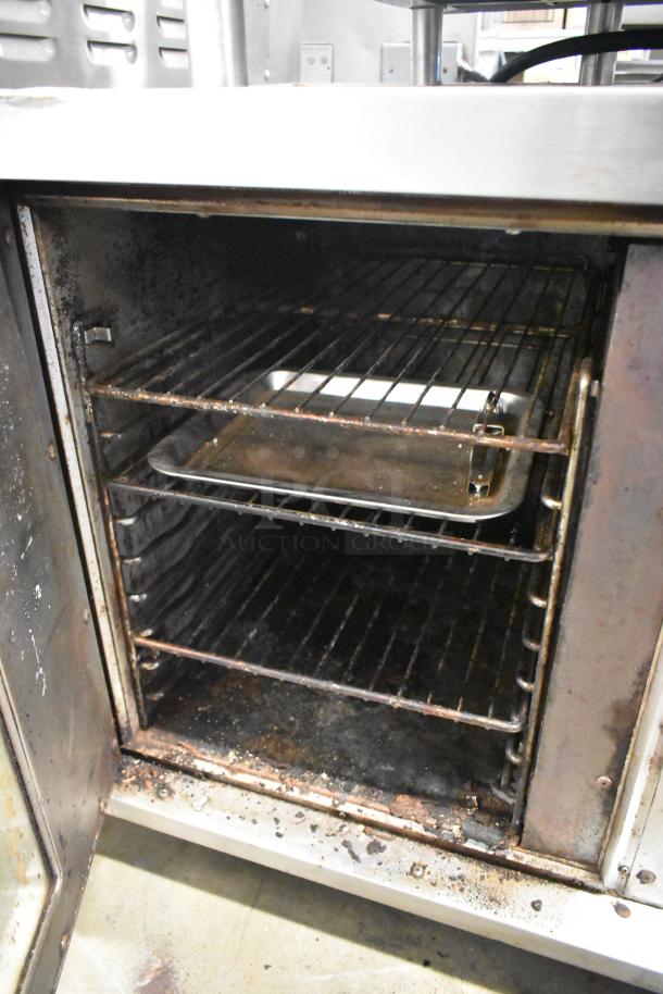 Hobart stainless steel commercial half-size convection oven with view-through door; 208/240V, 1 phase. Interior racks, used condition.