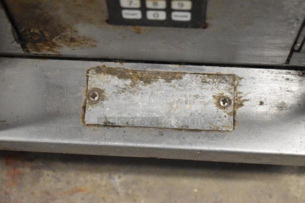 Hobart stainless steel commercial electric convection oven with view-through door. Visible wear and a metal label with specifications.