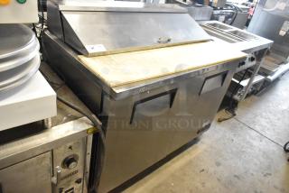 True TSSU-48-12 stainless steel prep table with bain marie top, on casters. 115 volts, 1 phase, commercial use.