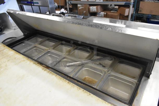 True TSSU-48-12 stainless steel sandwich salad prep table, bain marie top, on commercial casters, with food pans visible.