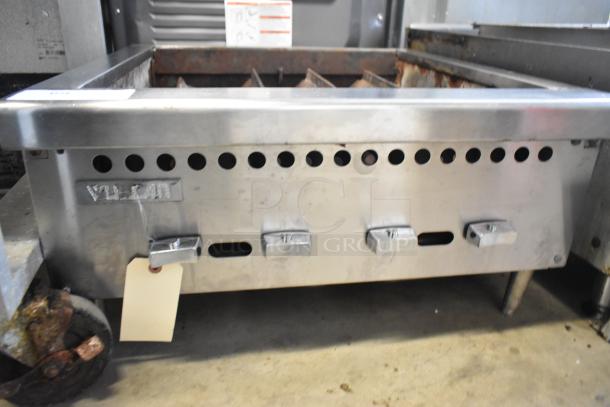 Vulcan stainless steel commercial countertop charbroiler grill, missing grates, with control knobs and visible branding.