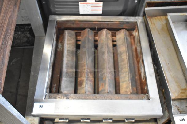 Vulcan stainless steel commercial countertop charbroiler. Missing grates. Signs of rust and wear. Auction tag visible.