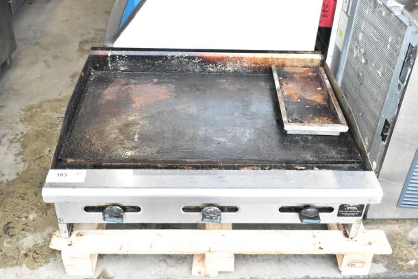 Radiance stainless steel commercial countertop flat top griddle, well-used condition, three control knobs, identification tag.
