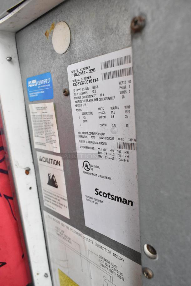 Scotsman C1030MA-32B Prodigy Plus ice machine label showing model, serial, electrical specs, and caution warnings.
