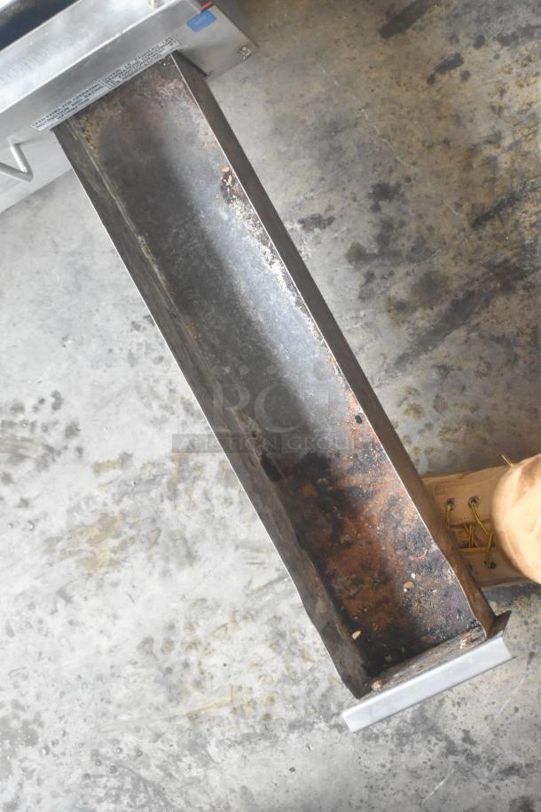 APW Wyott Stainless Steel Flat Top Griddle, commercial countertop model, visible wear, partially rusted metal surface.