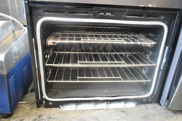KitchenAid KOCE500EBS11 stainless steel convection oven, open door, three racks, electric, visible wear. 208/240 Volts.