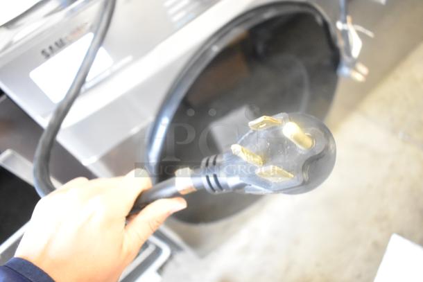 Samsung DVE45B6300P metal front load dryer, featuring a sleek design. Shown with 120/240V power cord.