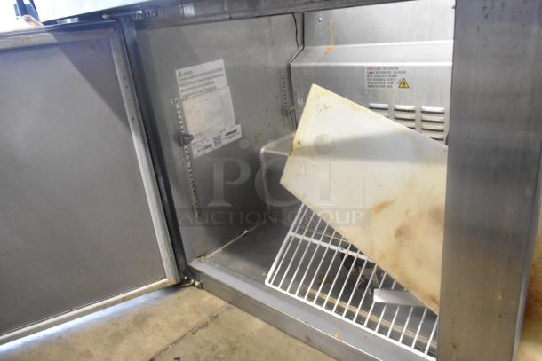 SLMPREP-2DW Stainless Steel Sandwich Salad Prep Table, 115V, shows interior with shelves and labeled warning.