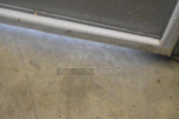 SLMPREP-2DW stainless steel sandwich salad prep table. Features Bain Marie mega top, 115V, 1 phase. Appears in used condition.