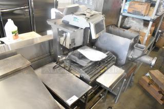 Mettler Toledo 0662 Metal Commercial Floor Style Wrapping Station in used condition. Features stainless steel surfaces and digital controls.