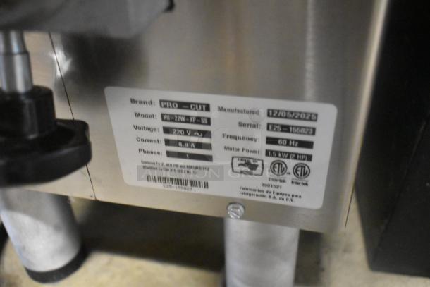 Pro-cut KG-22W-XP-SS meat grinder label, showing model, 220V, 1.6 kW power, serial E26-156623, manufactured 12/05/2025.