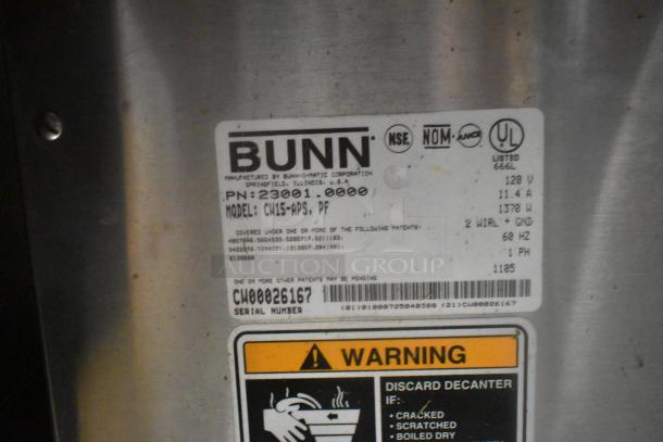 Bunn CW15-APS Coffee Machine label showing model, 120V, 1-phase power, and serial number CW00026167. Warning label visible.
