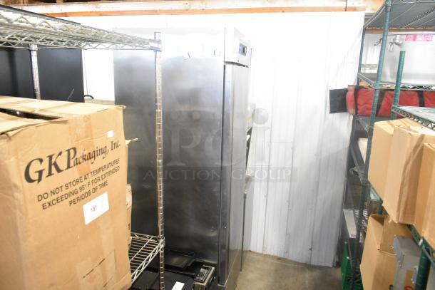 Fagor QVF-1 stainless steel single door commercial freezer, 115 volts, 1 phase, visible in storage area.