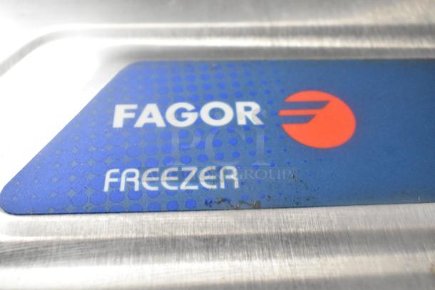 Fagor QVF-1 stainless steel freezer label close-up, featuring brand and model. Commercial-grade, 115 Volts, 1 Phase.