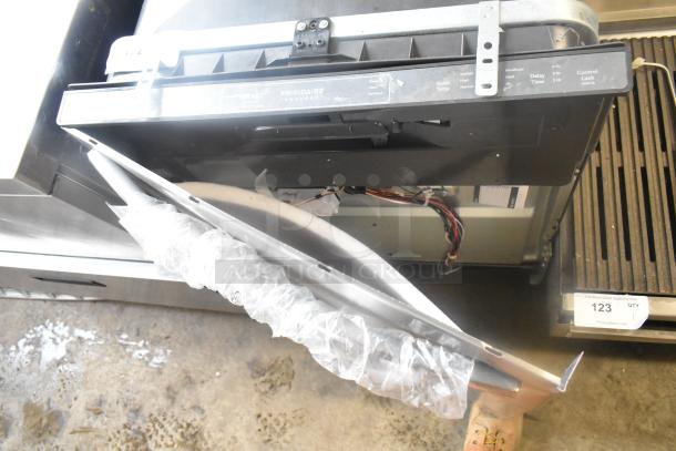 Frigidaire GDPH4515AF2B undercounter dishwasher, visible wiring, partially open door, model label, used condition.