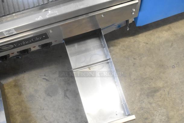 EmberGlo Stainless Steel Commercial Countertop Charbroiler Grill with visible EmberGlo logo and control knobs.