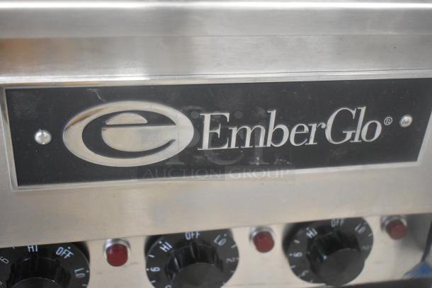 EmberGlo Stainless Steel Commercial Countertop Charbroiler Grill with visible logo and control knobs, in used condition.