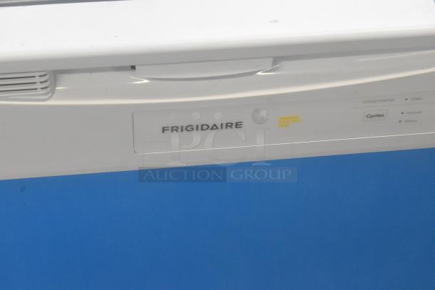 Frigidaire FDPC4221AW3A undercounter dishwasher, white, 115 volts, 1 phase, visible controls, protective film intact.