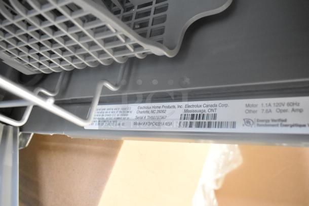 Frigidaire FDPC4221AW3A undercounter dishwasher label with serial number and energy verification. Model and specs visible.