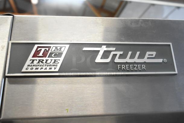 2017 True T-19F stainless steel commercial freezer, single door, poly coated racks, 115V, logo plaque shown.