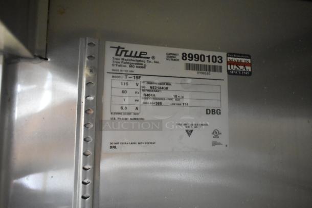 2017 True T-19F Stainless Steel Reach-In Freezer, 115 Volts, 1 Phase, with poly-coated racks and clear labels.