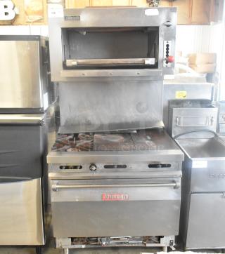 Vulcan stainless steel commercial gas griddle with 2-burner range, oven, and salamander cheese melter in used condition.