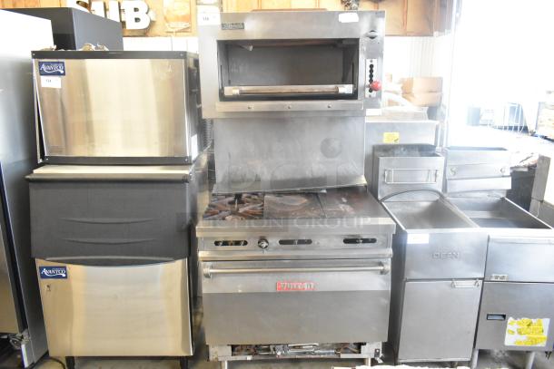 Vulcan stainless steel commercial gas griddle with 2 burners, oven, and salamander cheese melter. Used condition, visible markings.