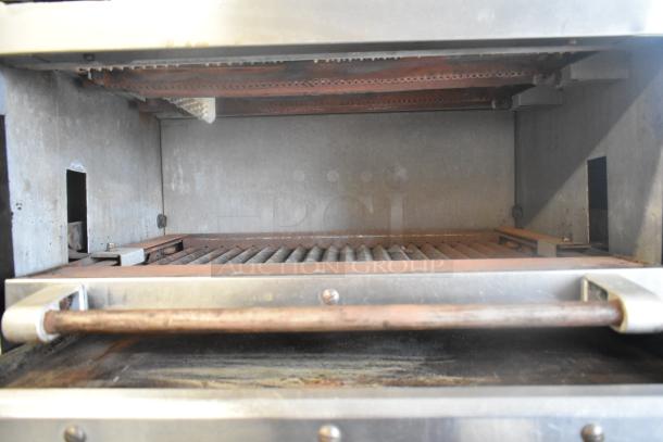 Vulcan stainless steel commercial gas flat top griddle with 2-burner range, oven, and salamander cheese melter. Used condition.