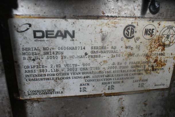 Dean SR142GN stainless steel deep fat fryer label, showing model, natural gas power, 105,000 BTU, and certification markings. Slight rust visible.