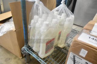 Six bottles of Maxim Facility One Step Disinfectant in plastic packaging, on a storage cart.