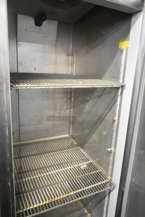 Fagor QVF-1 stainless steel commercial single door reach-in freezer, 115 volts, 1 phase. Interior shelving visible.