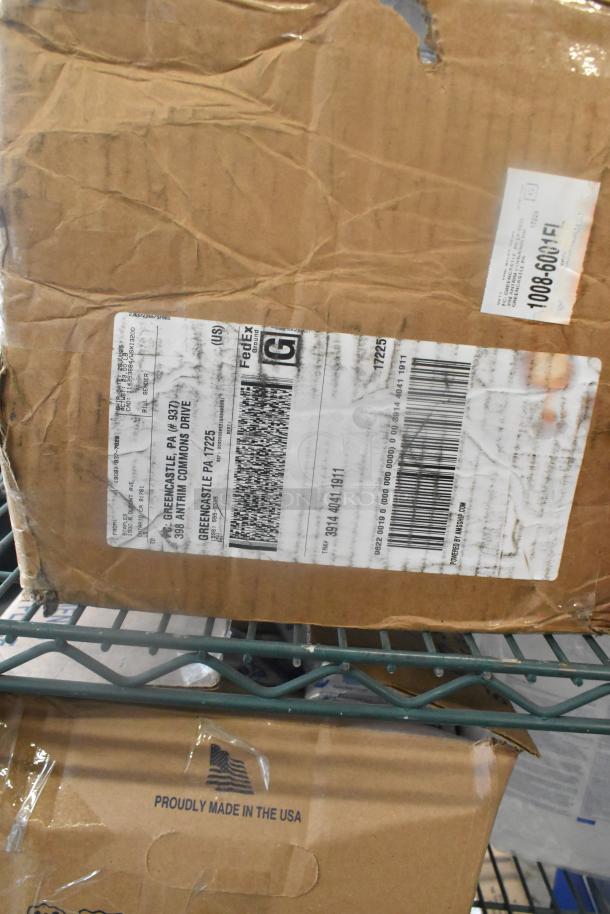 Cardboard box with FedEx shipping label, visible wear. Contains 12 various items like mayonnaise pouches and dispensers. Made in the USA.