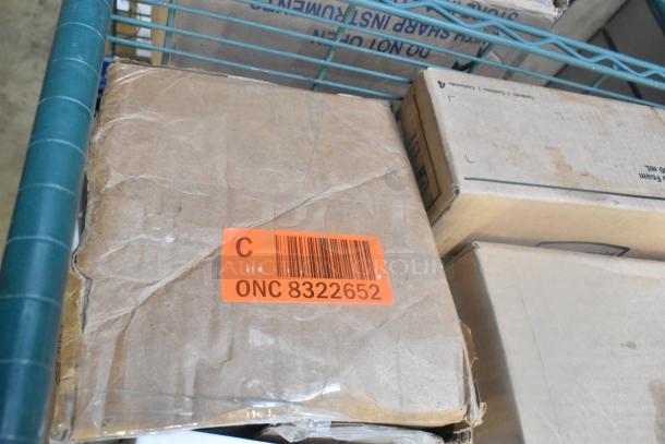 Cardboard box on a shelf with an orange label marked "C ONC 8322652," among various packaged items.
