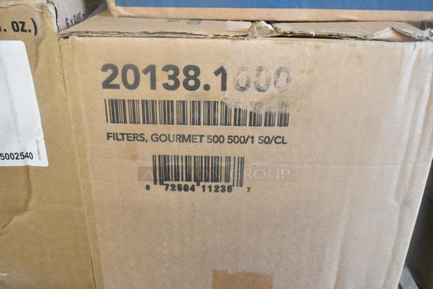 Cardboard box labeled "Filters, Gourmet 500 500/1 50/CL." Box is part of a lot with mayonnaise pouches and dispensers.