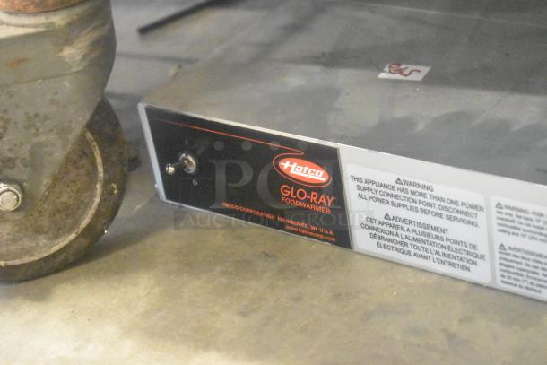 Hatco Metal Commercial Heat Strip, model Glo-Ray, used condition. Features a switch and warning label regarding power supply.