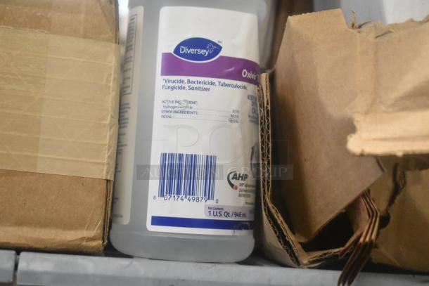 11 items lot including Diversey sanitizer with label details, cardboard box, and additional packaging.