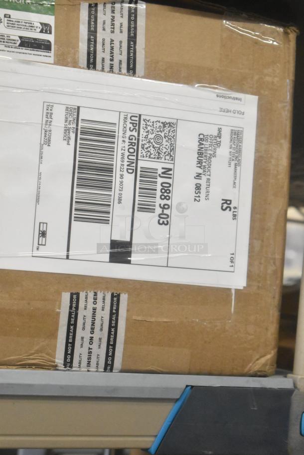 A sealed box labeled for UPS shipment, containing items like Diversey Sanitizer and Zebra Resin Ribbons, with genuine OEM seal.