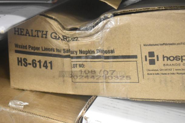Cardboard box of Health Gards HS-6141 waxed paper liners for sanitary napkin disposal, showing lot number 108/07, good condition.