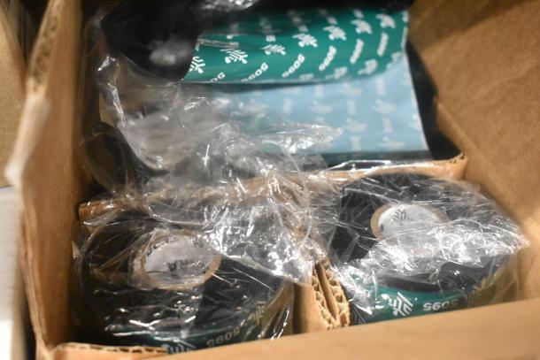 Box of various items including Zebra labels and paper liners for sanitary napkin disposal, in original packaging.